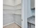 Spacious walk-in pantry with wire shelving for organized storage at 1580 Delphi Way, New Smyrna Beach, FL 32168