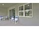 Relaxing covered patio with seating, perfect for outdoor enjoyment at 1580 Delphi Way, New Smyrna Beach, FL 32168