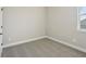 An empty bedroom shows neutral paint, plush carpet, and a window with views at 16454 Silver Brook Way, Winter Garden, FL 34787