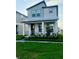 Charming two-story home featuring a well-manicured lawn and a welcoming front porch at 16454 Silver Brook Way, Winter Garden, FL 34787