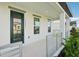 Inviting front porch featuring a modern railing, stylish door, and ample natural light at 16454 Silver Brook Way, Winter Garden, FL 34787