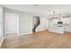Bright living space with an open floor plan combining the kitchen, living room, and staircase at 16454 Silver Brook Way, Winter Garden, FL 34787