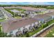 Scenic community view of townhomes near pond and community pool at 1900 Erudite Way, Winter Park, FL 32792