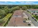 Aerial view of a neighborhood featuring townhomes and lush green trees at 1900 Erudite Way, Winter Park, FL 32792