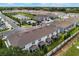 Community view of townhomes near pond and community pool at 1900 Erudite Way, Winter Park, FL 32792