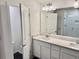 Bright bathroom features double vanity with quartz countertop and modern fixtures at 1900 Erudite Way, Winter Park, FL 32792