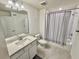 Bathroom featuring tile flooring, shower and sink with vanity at 1900 Erudite Way, Winter Park, FL 32792