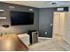 Open bedroom view, showcasing a desk setup, mini-fridge, and neutral colored carpet at 1900 Erudite Way, Winter Park, FL 32792