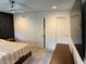 Bedroom boasts stylish accent wall, ceiling fan, and natural light from the window at 1900 Erudite Way, Winter Park, FL 32792