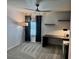 Bedroom featuring neutral carpet, a modern ceiling fan, and blackout curtains for a tranquil space at 1900 Erudite Way, Winter Park, FL 32792