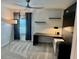Bedroom with sleek desk and wall shelves for a contemporary workspace, and neutral colored carpet at 1900 Erudite Way, Winter Park, FL 32792