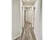 Neutral hallway featuring grey carpet and white walls, enhanced by recessed lighting at 1900 Erudite Way, Winter Park, FL 32792