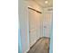 Hallway featuring neutral colored walls, carpet and closet space at 1900 Erudite Way, Winter Park, FL 32792