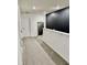 Second floor landing with an accent mirror, gray carpet, and white doors at 1900 Erudite Way, Winter Park, FL 32792