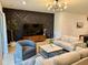 Stylish living room featuring modern decor, statement lighting, and wood flooring throughout at 1900 Erudite Way, Winter Park, FL 32792
