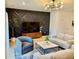 Stylish living room featuring a modern accent wall, statement lighting, and inviting seating area at 1900 Erudite Way, Winter Park, FL 32792