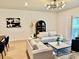 Inviting living room with neutral decor, statement lighting, and lots of natural light at 1900 Erudite Way, Winter Park, FL 32792