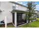 Screened in back patio with seating area and backyard at 1900 Erudite Way, Winter Park, FL 32792