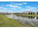 Scenic view of a community pond with a fountain and surrounding greenery at 1900 Erudite Way, Winter Park, FL 32792
