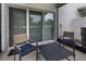 Relaxing screened patio with patio furniture and sliding glass doors at 1900 Erudite Way, Winter Park, FL 32792