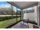 The screened lanai has seating, views, and brings the outdoors in at 1900 Erudite Way, Winter Park, FL 32792