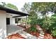 This backyard has a covered patio and access to mature landscaping at 2524 Shadybranch Dr, Orlando, FL 32822