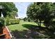 The backyard is mostly grass with a canal in the distance at 2524 Shadybranch Dr, Orlando, FL 32822