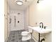 Bathroom featuring decorative tile floor, a walk-in shower, and a pedestal sink at 2524 Shadybranch Dr, Orlando, FL 32822