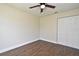 This bedroom has a ceiling fan and a closet with bi-fold doors at 2524 Shadybranch Dr, Orlando, FL 32822