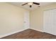 Bedroom featuring wood-look flooring, a ceiling fan, and a double-door closet at 2524 Shadybranch Dr, Orlando, FL 32822
