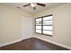 Bedroom featuring wood-look flooring, a ceiling fan, and a window view of the front yard at 2524 Shadybranch Dr, Orlando, FL 32822