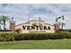 The community entrance sign Ventura Country Club is surrounded by pretty plants, trees and bushes at 2524 Shadybranch Dr, Orlando, FL 32822