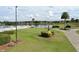 Scenic view of Ventura's golf course, putting green, lake and pool at 2524 Shadybranch Dr, Orlando, FL 32822