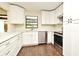 Updated kitchen with white cabinets, stainless steel appliances, and a view to the outdoor patio at 2524 Shadybranch Dr, Orlando, FL 32822