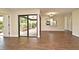 Open living area with wood-look tile, and a view of the outdoor patio at 2524 Shadybranch Dr, Orlando, FL 32822