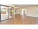Open living space featuring wood-look tile and sliding doors to the outdoor area at 2524 Shadybranch Dr, Orlando, FL 32822