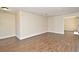 Spacious living area with wood-look tile flooring and neutral wall colors at 2524 Shadybranch Dr, Orlando, FL 32822