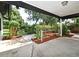 This covered patio has access to a garden with mature landscaping at 2524 Shadybranch Dr, Orlando, FL 32822