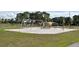 Outdoor playground with swings and slides in a spacious, grassy community park at 2524 Shadybranch Dr, Orlando, FL 32822