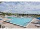 Enjoy the expansive community pool with a lake view at 2524 Shadybranch Dr, Orlando, FL 32822
