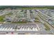 An aerial view showcases a well-planned community featuring numerous homes and winding streets at 2716 Pierr St, Davenport, FL 33837