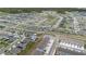 An aerial view showcases a well-planned community featuring numerous homes and winding streets at 2716 Pierr St, Davenport, FL 33837