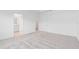 A primary bedroom featuring neutral paint, carpet flooring, and an ensuite bathroom and walk-in closet at 2716 Pierr St, Davenport, FL 33837