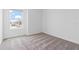 A bedroom with neutral paint, carpet flooring, and a bright window that offers neighborhood views at 2716 Pierr St, Davenport, FL 33837
