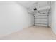 An empty two car garage with a white painted interior at 2716 Pierr St, Davenport, FL 33837