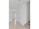 Bright hallway featuring neutral tile floors and white doors at 2716 Pierr St, Davenport, FL 33837