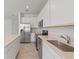 Spacious kitchen with white cabinets, stainless steel appliances, and a modern faucet at 2716 Pierr St, Davenport, FL 33837