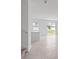 Bright and airy living space with tile flooring, and sliding glass doors to the backyard at 2716 Pierr St, Davenport, FL 33837