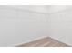 A walk-in closet with wire shelving and neutral carpet flooring at 2716 Pierr St, Davenport, FL 33837
