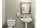 Bathroom featuring a pedestal sink and toilet at 2746 Windsorgate Ln, Orlando, FL 32828